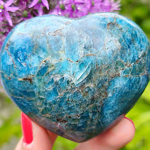 Smooth apatite heart in the palm of 299 grams