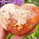 Smooth carnelian heart in the palm of 6.4 cm