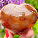 Heart made of carnelian stone in the palm of 6.1 cm